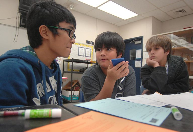 Inverness Middle School sixth-graders from left, Gerald Banawan, Kevin Parker and Eli Moore work together on their STEM class project. Photo by Matthew Beck, Photo Editor of the Citrus County Chronicle